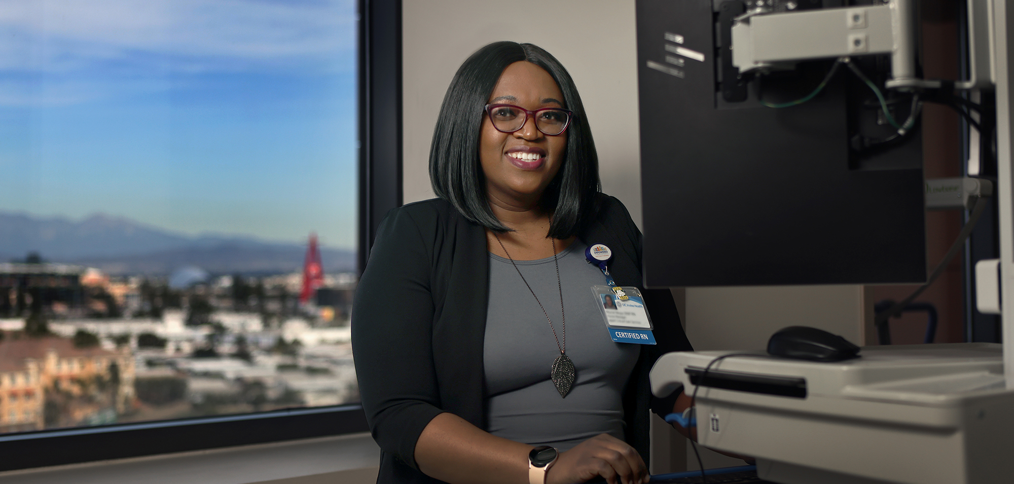 nurse manager standing in front of a monitor